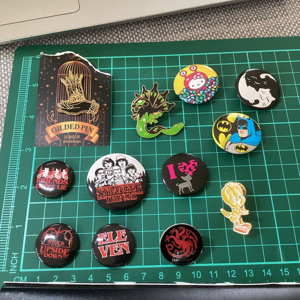 12 various button pins and push back pins lot